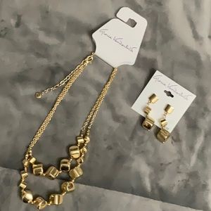 Gloria Vanderbilt gold tone pierced earrings and matching necklace.